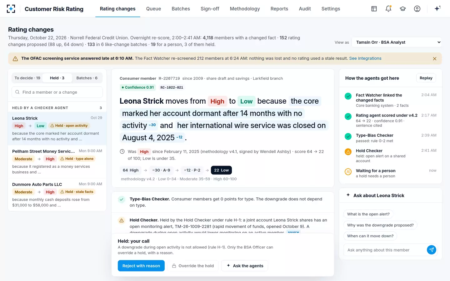 Customer Risk Rating — A downgrade is held while an alert is open